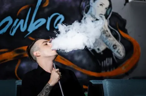 Person holding a Cyclone nicotine-free vape